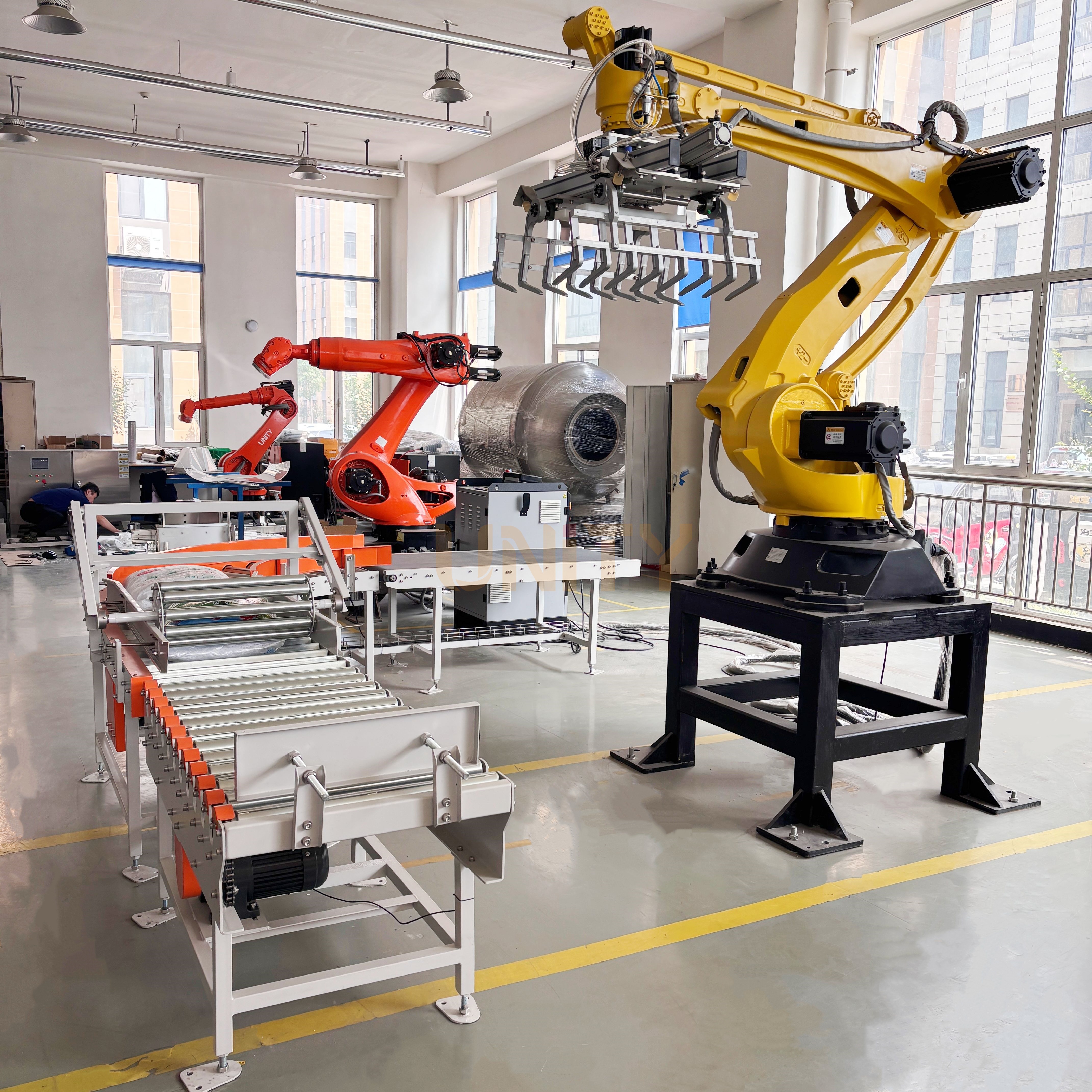 Automated robotic arm stacking boxes in a warehouse
